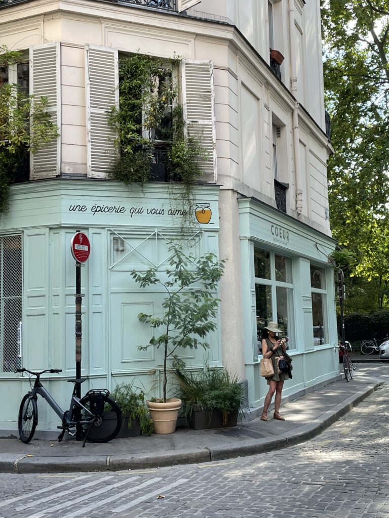 Picturesque Paris corner with local store and tree-lined street