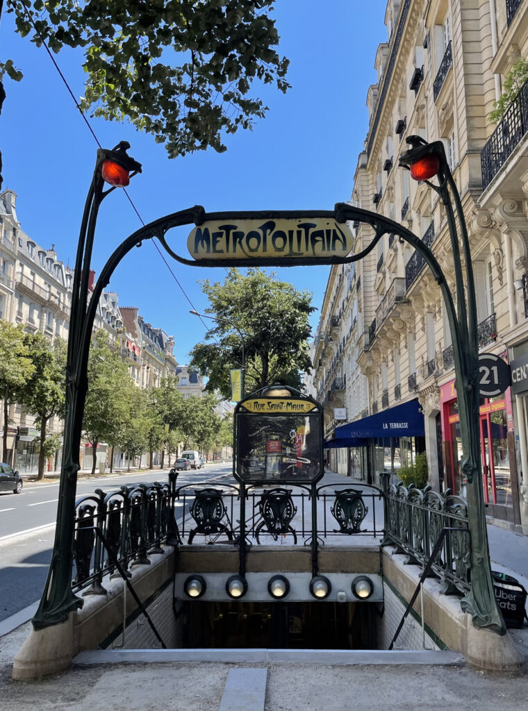 Classic Parisian metro entrance with Art Nouveau design on Rue Saint-Maur.